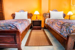 Postel nebo postele na pokoji v ubytování Hotel El Auca