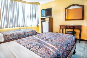 Postel nebo postele na pokoji v ubytování Hotel El Auca