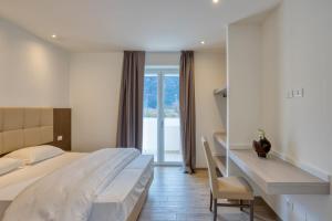 Postel nebo postele na pokoji v ubytování Barambana Rooms