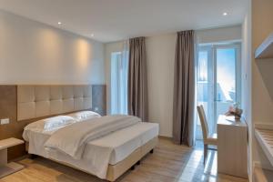 Postel nebo postele na pokoji v ubytování Barambana Rooms