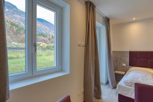 Postel nebo postele na pokoji v ubytování Barambana Rooms + 10 fotografií