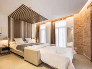 Mon Suites Benlliure客房内的一张或多张床位