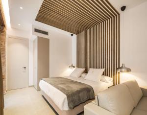 Mon Suites Benlliure客房内的一张或多张床位