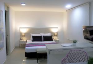 Кровать или кровати в номере Hotel Suite Comfort