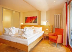 Postel nebo postele na pokoji v ubytování Bio Thermalhotel Falkenhof