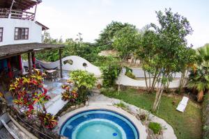 an overhead view of a backyard with a swimming pool at Hotel La Punta in Montañita