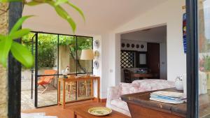 a living room with a couch and a table at Case di Berto in Capo Vaticano