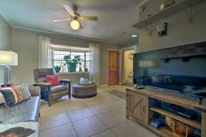 a living room with a large flat screen tv at El Paso Home with Backyard and Outdoor Fireplace! in El Paso