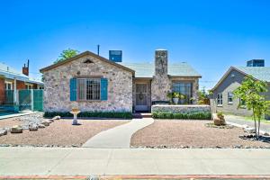 a stone house with a blue window at El Paso Home with Backyard and Outdoor Fireplace! in El Paso