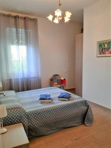 Posteľ alebo postele v izbe v ubytovaní La Corte di Marino