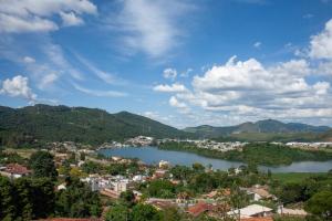 a view of a town and a lake in a city at Amsterdam Lofts Deluxe in Poços de Caldas +5 photos