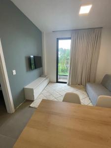 Uma TV ou centro de entretenimento em Village dos Gerânios