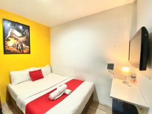 Hotel Aman- Nilai & KLIA客房内的一张或多张床位