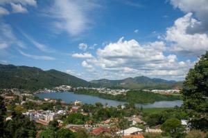 a view of a town and a river in a city at Amsterdam Lofts Deluxe in Poços de Caldas