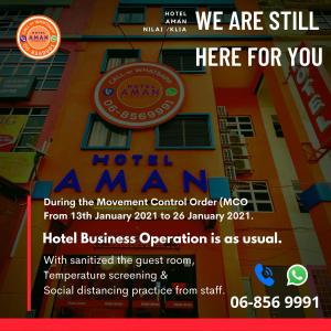 Hotel Aman- Nilai & KLIA في نيلاي: منشر لحدث أمام المبنى