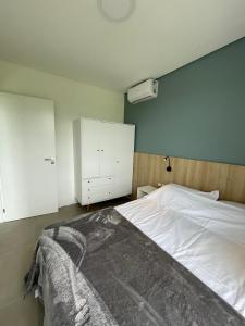 Cama ou camas em um quarto em Village dos Gerânios