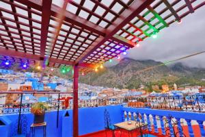 a view of the city from a balcony of a town at AYMANE ROOFTOP budget panoramic HOTEL in Chefchaouen