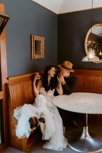 a man and a woman sitting in a table at Shelburne Hotel in Seaview