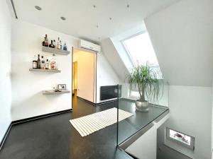a living room with a glass table and a window at All NEW FLAT NEARBY DRESDEN !!!POOL!!! in Frauendorf