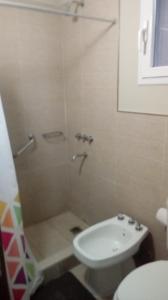 a bathroom with a shower and a white sink at Entre Gaviotas in Las Gaviotas +5 photos