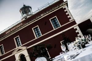 a building with a lighthouse on top of it at Faro Capo Spartivento in Chia