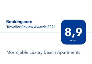 een blauw vierkant met het nummer erop bij Morrojable Luxury Beach Apartments in Morro del Jable