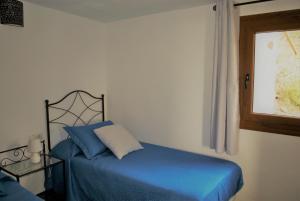 A bed or beds in a room at Finca Ulises Las Hayas