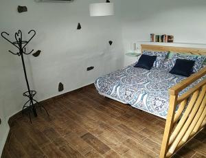 A bed or beds in a room at Finca Ulises Las Hayas