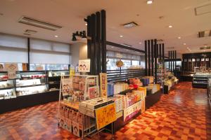 a grocery store with a display of products at Hotel Sekumiya in Obama