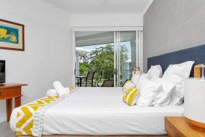 Letto o letti in una camera di Seascape Holidays at Beaches Port Douglas
