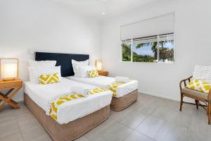 Letto o letti in una camera di Seascape Holidays at Beaches Port Douglas