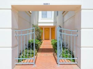 an entrance to a building with a yellow door at Beach Break in Yamba