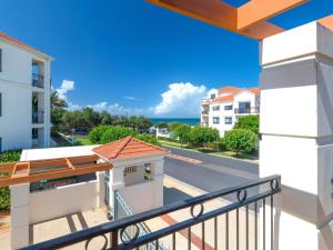 a balcony with a view of the ocean at Beach Break in Yamba