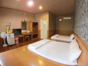 Una cama o camas en una habitación de WangWang B&B