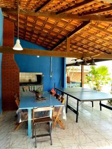 a dining room with two ping pong tables at Pousada e Condominio Miragem Do Mar Praia Do Peró in Cabo Frio +74 photos