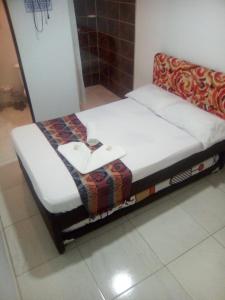 Postel nebo postele na pokoji v ubytování montecarlos hotel