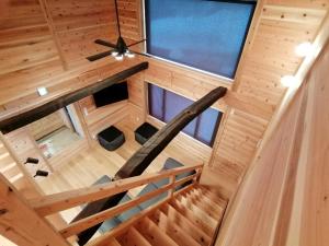 an overhead view of a staircase in a tiny house at Tombi Lodge in Iiyama