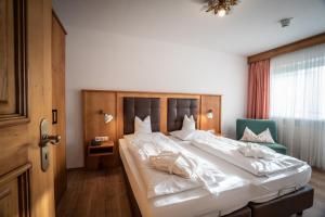 Postel nebo postele na pokoji v ubytování Alpenstadthotels