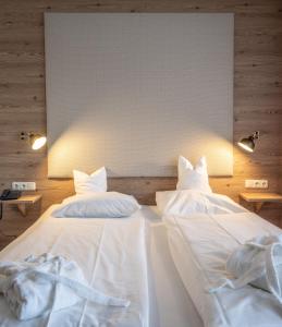 Postel nebo postele na pokoji v ubytování Alpenstadthotels