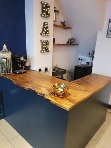 a wooden counter top with a bird cage on it at Enchanted Hideaway, Bath in Bath