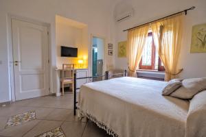 Postel nebo postele na pokoji v ubytování B&B Il Vicolo