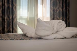 Una cama o camas en una habitación de Point de vue Guesthouse