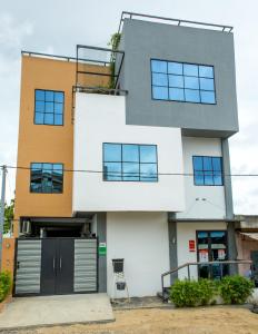 a modern house with a lot of windows at IMOLEASE Kouessi Menontin in Cotonou