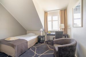 Voodi või voodid majutusasutuse Hotel Dania toas