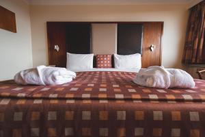 Ένα ή περισσότερα κρεβάτια σε δωμάτιο στο Muthu Glasgow River Hotel