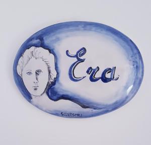 a blue and white glass object with an image of a woman at Olimpo degli Dei in Agerola