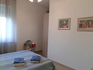 Posteľ alebo postele v izbe v ubytovaní La Corte di Marino