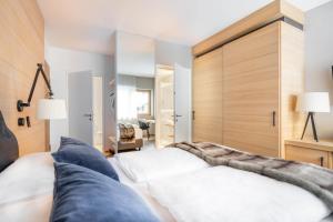 Postel nebo postele na pokoji v ubytování Sporthotel Chalet + 29 fotografií