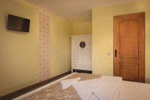 Postel nebo postele na pokoji v ubytování Casa Sasului
