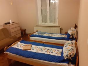 En eller flere senge i et værelse på Kamienica